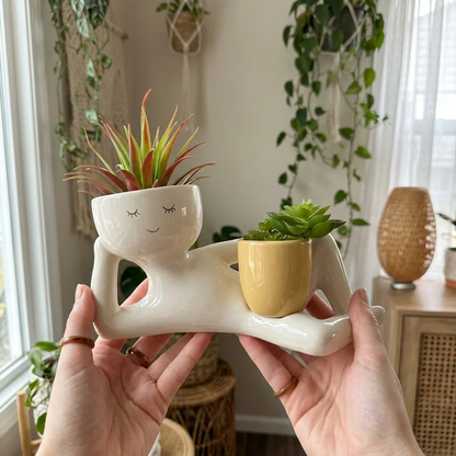 The Daydreamer planter held in hands for scale