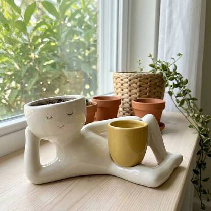 The Daydreamer ceramic planter on a windowsill